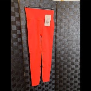 Bright orange Fabletics leggings